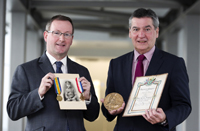 Queen’s Vice Chancellor Professor Patrick Johnston and University of Ulster Vice-Chancellor Professor Richard Barnett pictured with just a few of the World War One artefacts that will be collected, interpreted and shared by university researchers at the new Living Legacies World War One Engagement Centre. Artefacts courtesy of the Royal Ulster Rifles Museum.