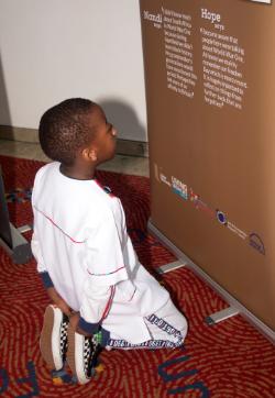 DIVERSE PERSPECTIVES - Boy reading panel (photo Gerry Temple)